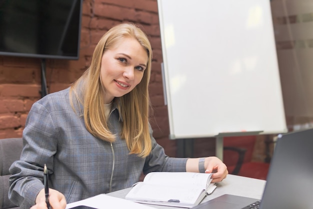 An open journal and fountain pen on a desk